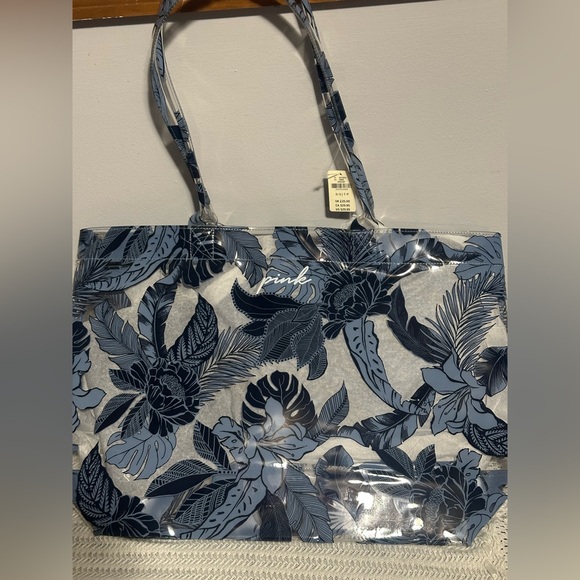 Clear beach bag with blue floral design. - Picture 1 of 6